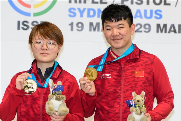 Zhu Yingjie and Liu Yuqi bring the Chinese flag atop the Air Rifle Mixed Team podium